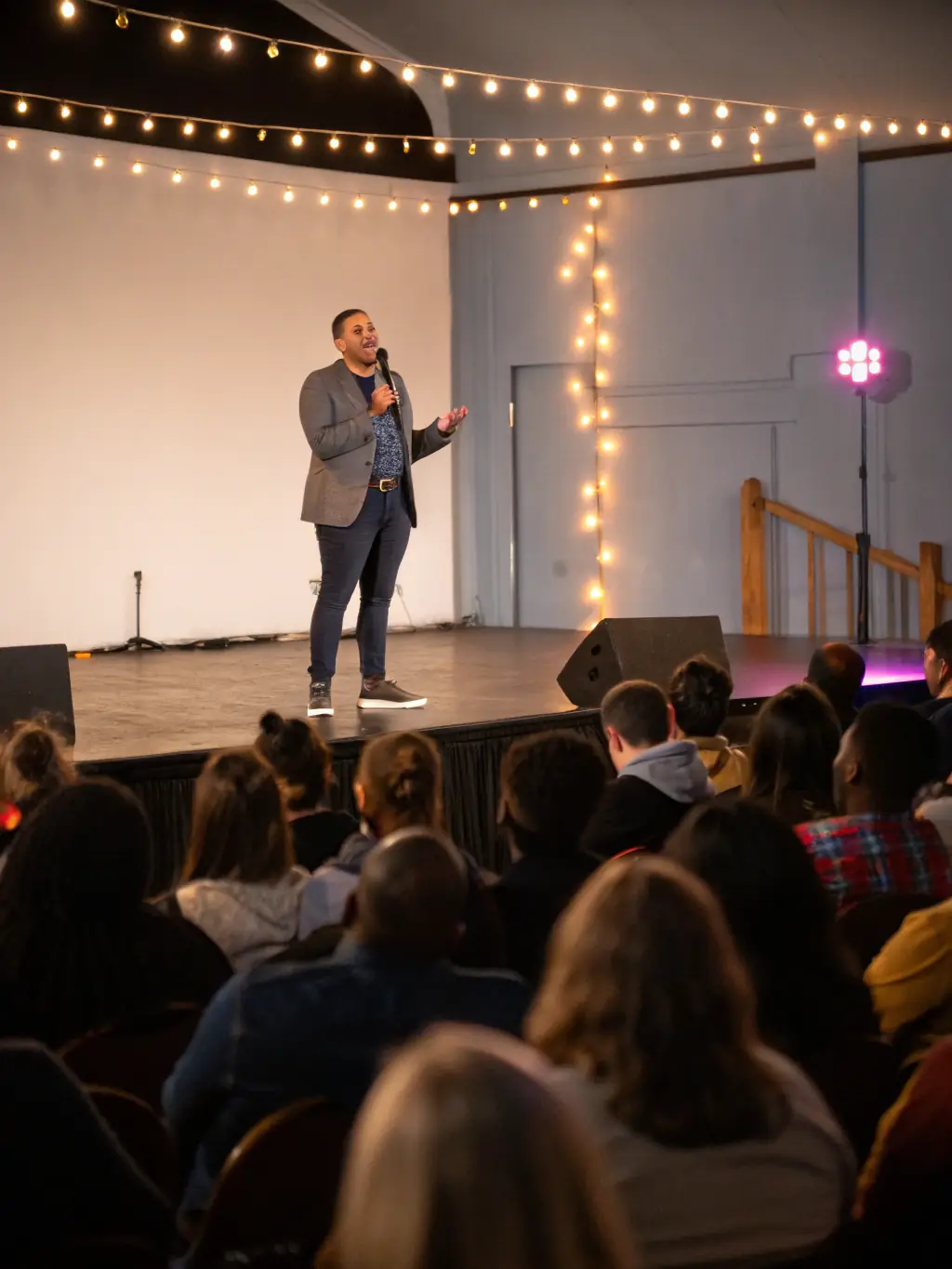 A speaker presenting an anti-doping awareness seminar to a group of attentive athletes, highlighting the importance of clean sport and ethical practices.